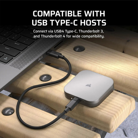 Blazing Fast USB4 Portable External Type-C SSD 2TB With 4000 MBps Read And 3600 MBps Write connected to laptop via USB-C cable.
