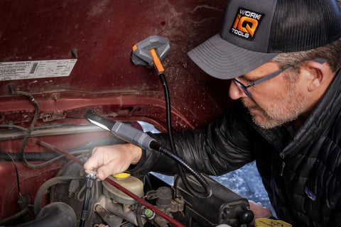 Mechanic using IQ Connect Pro Grade Hands Free Accessory System With Three Bench Mounts under car hood