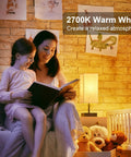 Mother and child reading beside a Beige Bedside Table Lamp With USB C And USB A Ports 3 Way Dimmable Touch Control LED Bulbs Included Flicker Free Eye Friendly Nightstand Light For Bedroom Living Room Office.