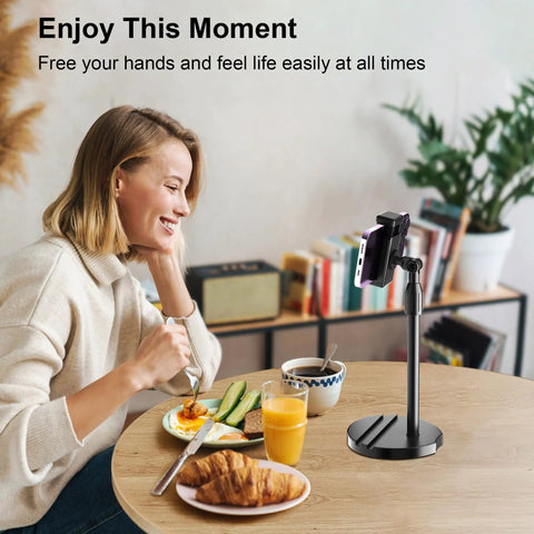 Woman using Telescopic Webcam Tripod Desk Mount With Phone Holder, Adjustable 11.4 To 18.7 Inches, at breakfast table