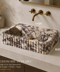Calacatta Viola Marble Apron Sink, Hand-Carved Fluted Bathroom Washbasin, rectangular natural stone basin on countertop.