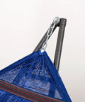 Close-up of navy hammock on steel stand, part of Heavy Duty Outdoor Hammock With Collapsible Steel Stand And Carrying Case, On The Go And Adjustable, Holds Up To 450 Lb Capacity, Navy Foldable Hammock Set For Camping Beach Patio.