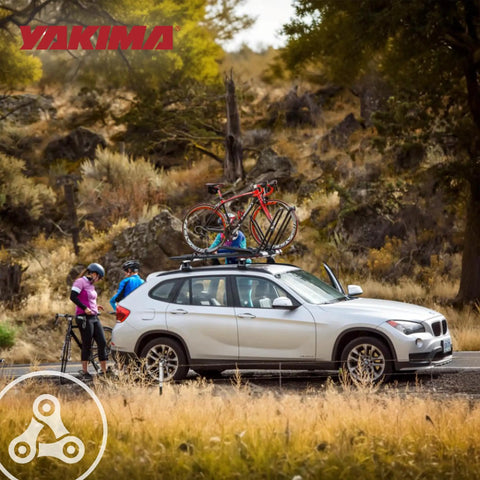 Rooftop Upright Bike Mount Carrier For Wheelbases Up To 52 Inches on car roof with cyclists nearby, outdoors in park