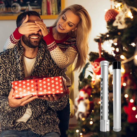 Aluminum Golf Ball Shag Tube Picker Upper With Easy Grip Top Handle Durable Ball Retriever For Practice And On Course Use Sucker Style Ball Pickup Tool For Seamless Retrieval shown next to a couple exchanging gifts by a Christmas tree.