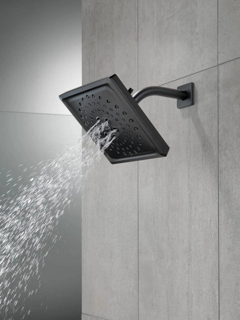 Matte Black Universal Shower Arm Replacement For RP6023BL With Durable Brass Build Easy Install And Universal Fit For Most Shower Faucets Finish Guaranteed Lifetime Warranty Dope Upgrade For Any Modern Bathroom, installed with square shower head spraying water on tiled wall.