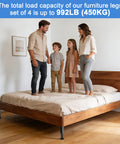 Family standing on bed with Heavy Duty Adjustable Bed Support Legs Set Of Four With Swivel Rubber Feet Non Slip Base 7 To 12 Inch Height Adjustment.
