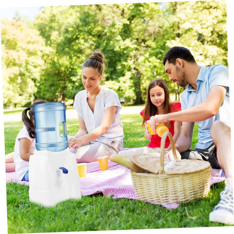 Family picnic with Portable Cold Water Dispenser For Office Desk Countertop With Tap next to a picnic basket on grass