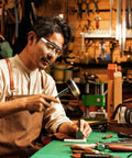 Kick Up Dust Without Fogging Out These Safety Glasses Fit Seamless Over Your Specs Scratch Proof Lenses ANSI Certified Gear worn by a man in workshop.