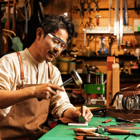 Kick Up Dust Without Fogging Out These Safety Glasses Fit Seamless Over Your Specs Scratch Proof Lenses ANSI Certified Gear worn by a man in workshop.