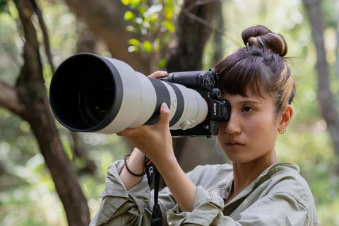 Photographer using Alpha 7R VI with VGC6 Vertical Grip for stability, dual battery power, and ergonomic front and rear dial alignment.