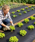 Gardener using 6 Ft By 300 Ft Heavy Duty Yard Work Ready Weed Barrier Fabric With 3.2 Oz Landscape Material in vegetable garden