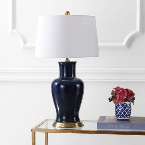 Navy Ceramic Urn LED Table Lamp, 29 Inch, Traditional Classic Style, White Linen Drum Shade on a glass table in living room
