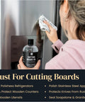 Person polishing stainless steel fridge with Food Grade Mineral Oil For Wood Cutting Boards And Butcher Blocks 16oz Safe For Bamboo Marble Soapstone And Stainless Steel Counters Made In USA Top Notch Kitchen Care And Conditioning For Long Lasting Finish