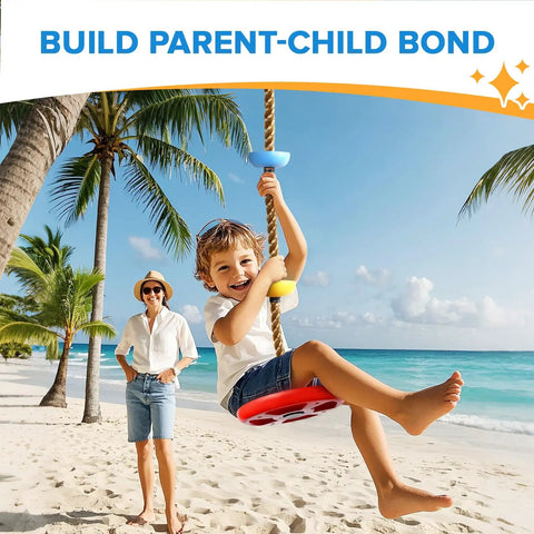 Child using Climbing Rope Tree Swing With Platforms And Seat For Kids on beach with parent in background.
