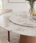 Built Different 53 Inch Round Dining Table Featuring Removable Lazy Susan Gold Ring Faux Marble Top with fruit bowl