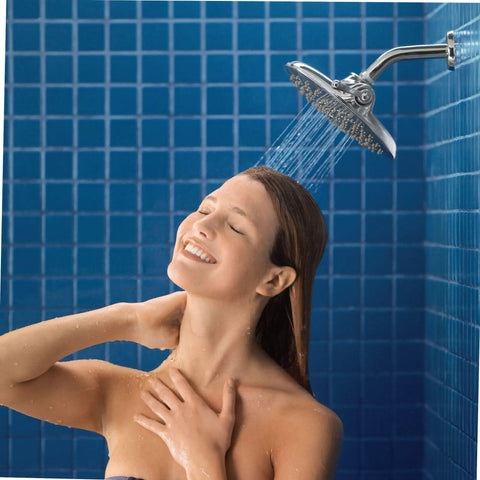 Woman enjoying shower under Velocity Chrome Two-Function Rain Shower Head With Immersion Technology, 8-Inch Wide Spray, Easy Install
