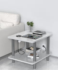 Sleek Flush Mount Power Grommet Featuring Four Standard Outlets And Four USB C Fast Charging Ports For Your Next Big Boss Setup And Countertop Organization Game Changer For Modern Home Office Black Dual Sided Design Six Foot Cord on a modern gray table with gadgets.