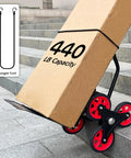 Stair Climber Hand Truck Dolly with Telescoping Handle Heavy Duty 440 Lb Capacity shown with box on stairs and bungee cord inset