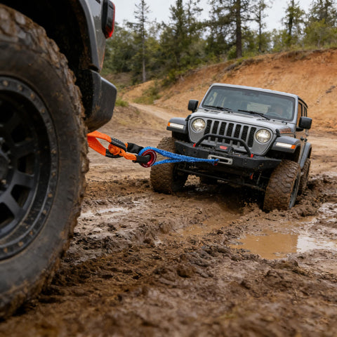 Off-road Jeep using UHMWPE Soft Shackle Two Pack With Space Aluminum Recovery Ring for recovery in muddy terrain