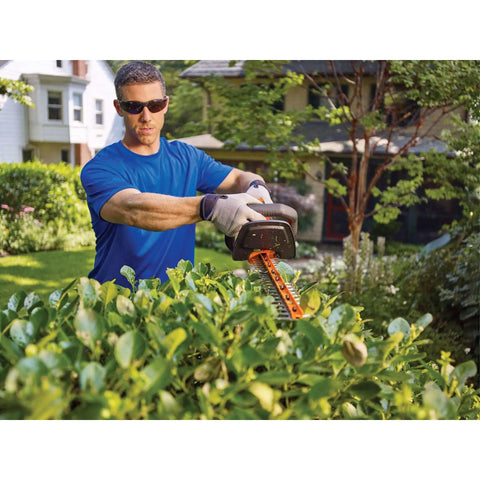 Man using 40V MAX Cordless Hedge Trimmer With 24 Inch Dual Action Blade, No Cords Needed, Long Battery Life, Includes Battery and Charger