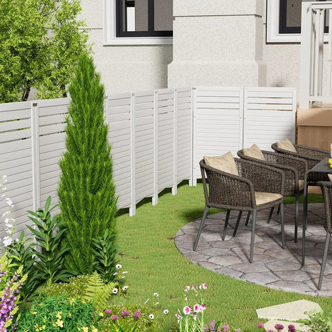 Outdoor Privacy Screen for Air Conditioner Unit with Four Panels, Resin Fence Kit, white, set in a garden with patio chairs.
