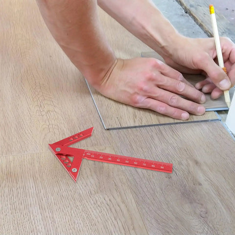 Dead On Aluminum Center Scriber Marking Gauge Wheel For Slick Woodworking Line Scribing And 45 Degree Angle Layouts In Professional Carpentry Workshops with red handle on wood flooring.