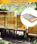 3 Pack 10 Frame Beehive Metal Screened Bottom Boards With Entrance Reducers set in apiary beeyard setting.
