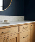 Brushed Antique Brass Wavy Cabinet Pulls With Five Inch Hole Centers on wooden bathroom cabinets under marble counter
