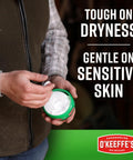 Person holding Working Hands Hand Cream For Extreme Dryness Heavy Duty Moisturizer 3.4 Oz Jar That Really Fixes Cracked Hands