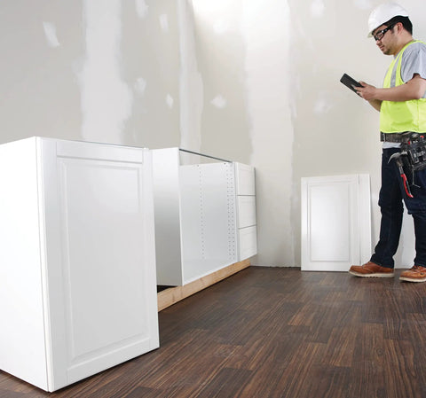 Worker using GLM 50 C Laser Distance Meter 165 Ft with Backlit Display for measuring room dimensions