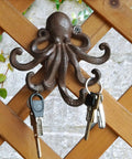 Heavy Duty Cast Iron Octopus Wall Hooks With Sleek Nautical Vibes And Aged Dark Brown Finish For Hanging Coats Keys Towels And Gear Built Like A Tank With Real Antique Charm That Truly Pops, displaying keys.