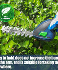 Person using 7.2V Cordless Grass Shear And Shrub Trimmer 2 In 1 Mini Hedge Cutter on green shrub