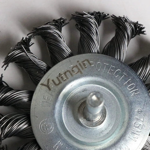 Close-up of Three Piece Knotted Wire Wheel Brush Set For Drill With One Quarter Inch Shank showing twisted metal wires