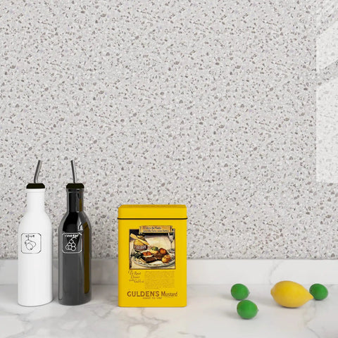 Granite Contact Paper Peel And Stick For Kitchen Countertops Cabinets And Tables Budget Friendly Waterproof Self Adhesive Vinyl Wallpaper In Grey Marble Look 36 Inch By 200 Inch Roll Removable Repositionable With No Residue applied on kitchen wall with condiments and fruit.