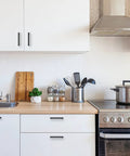 Modern kitchen featuring 60 Pack Sleek Matte Black Square Cabinet Handles Drawer Pulls For Kitchen Cabinets Wardrobe And Furniture Stainless Steel Hardware With Five Inch Center To Center Hole And Five And One Half Inch Length One Half Inch Width One Half Inch Thick on white cabinets.