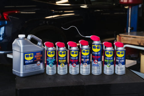 WD-40 Specialist contact cleaner spray can with red straw, shown with six 11 oz cans for cleaning electrical parts