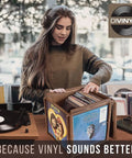 Rotating Vinyl Record Storage Box 4 In 1 Wooden Display Cube for 100 LP Records shown with person selecting records.