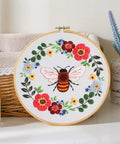 Bee embroidery in hoop with floral design, part of All In One Bee Embroidery Kit For Beginners With Hoop And Thread, 3 Pack Cross Stitch Hand Embroidery Sets.
