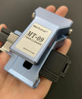 Boss Level Mt 09 Fiber Cleaver Automatic Cable Cutting Knife For Ftth Installations shown in hand, designed for precise fiber cutting.