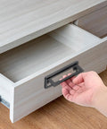 Hand using 2 Pack Flush Pull Handles For Cabinets And Drawers Hidden Recessed Square Pull Rings with silver finish, installed on drawer