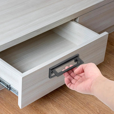 Hand using 2 Pack Flush Pull Handles For Cabinets And Drawers Hidden Recessed Square Pull Rings with silver finish, installed on drawer
