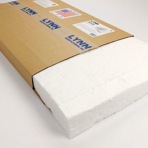 Front view of ceramic fiber insulation blanket, 2 in thick x 15 x 24 in, white block partially exposed from a brown shipping box.