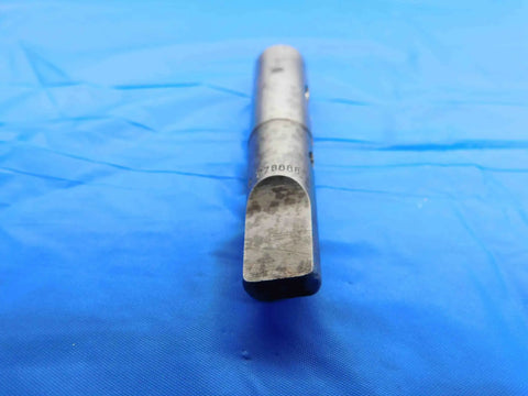 Close-up of Split Sleeve Driver For One Quarter Inch Hand Tap Morse Taper MT2 Machinist Tool BT3214AB3 on blue fabric.