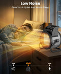 Portable 1500W PTC Ceramic Space Heater With Thermostat And 90 Degree Adjustable Angle on a nightstand beside sleeping couple