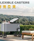 80 Quart Outdoor Rolling Ice Chest Wagon Cooler Cart With XL Wheels For Beach Patio And Parties Long Handle Beverage Cooler On Wheels For Easy Transport next to a pool with flexible casters and open lid showcasing bottled drinks.