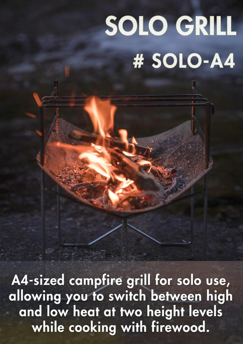 Solo Grill A4 Portable Camping Fire Pit with Foldable Frame, burning with firewood outdoors, showing compact design.