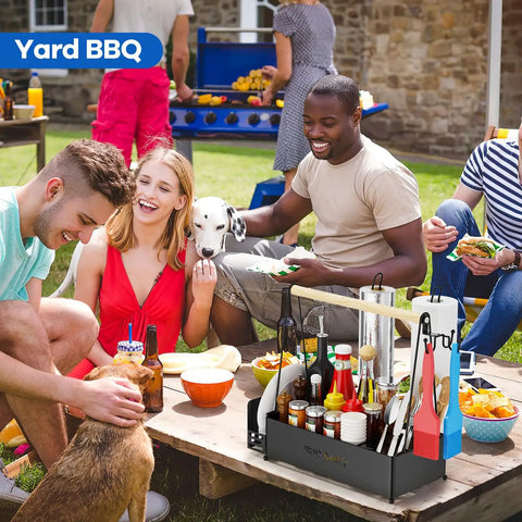 Outdoor BBQ scene with Grill Caddy With Dual Paper Towel Holders, condiments, and utensils on picnic table, surrounded by people
