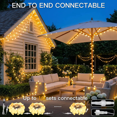 Warm White 33Ft 100 LED Connectable Globe String Lights With Remote illuminating outdoor patio seating area at night