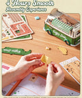 Hands assembling Retro Coffee Truck 3D Wood Puzzle Kit For Adults DIY Model Craft Building Set with instruction manual on desk.