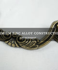 Close-up of Six Pack Antique Brass Drawer Pulls With Four And Three Quarters Inch Hole Centers, floral design, zinc alloy material